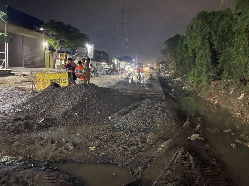 Workers at road construction site