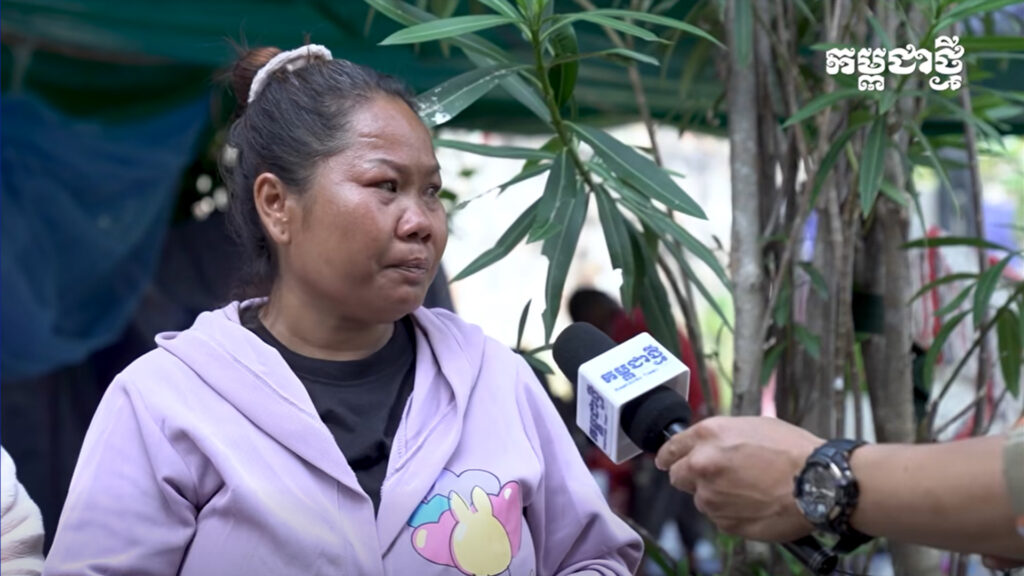 A Cambodian woman crying from a displaced camp