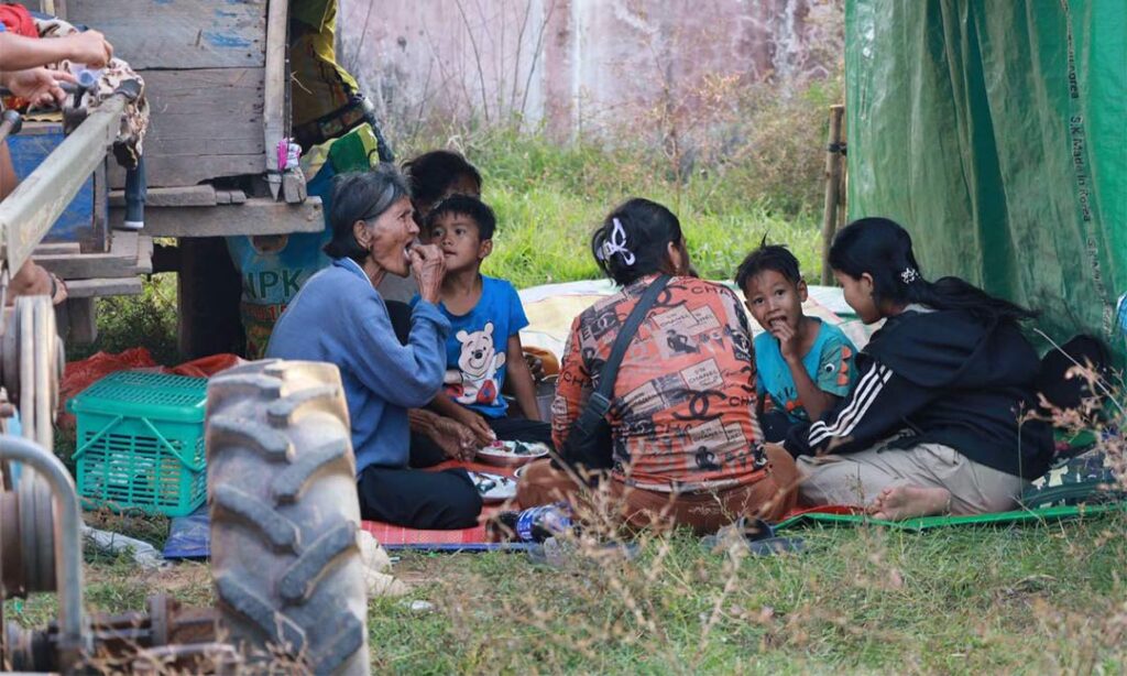 a displaced Cambodian family stop for a meal