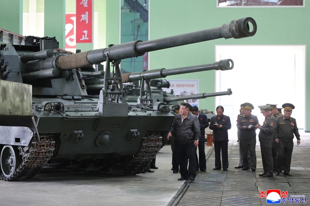Kim Jong Un with daughter on warship